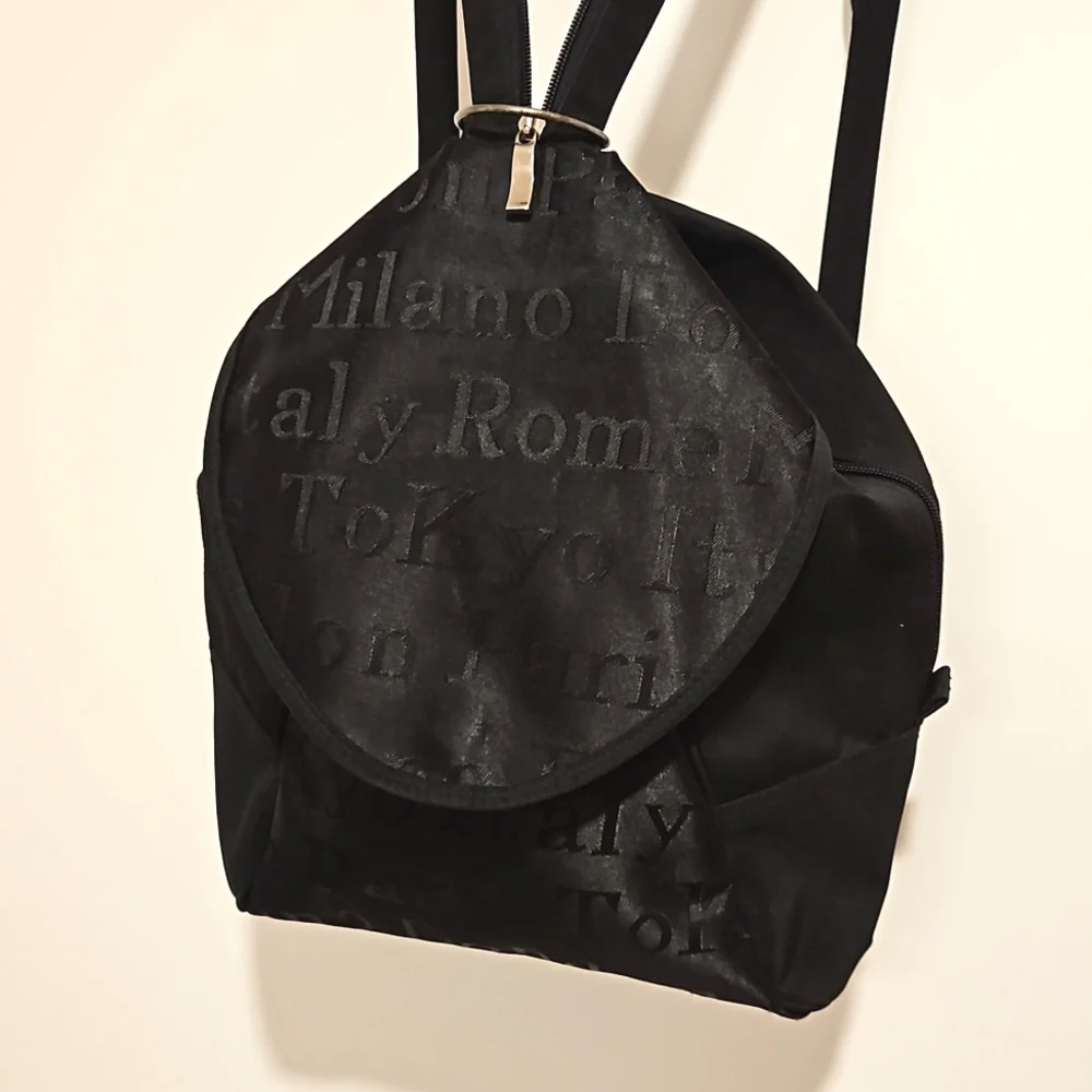 Black backpack convertible bag international city names on sections EUC